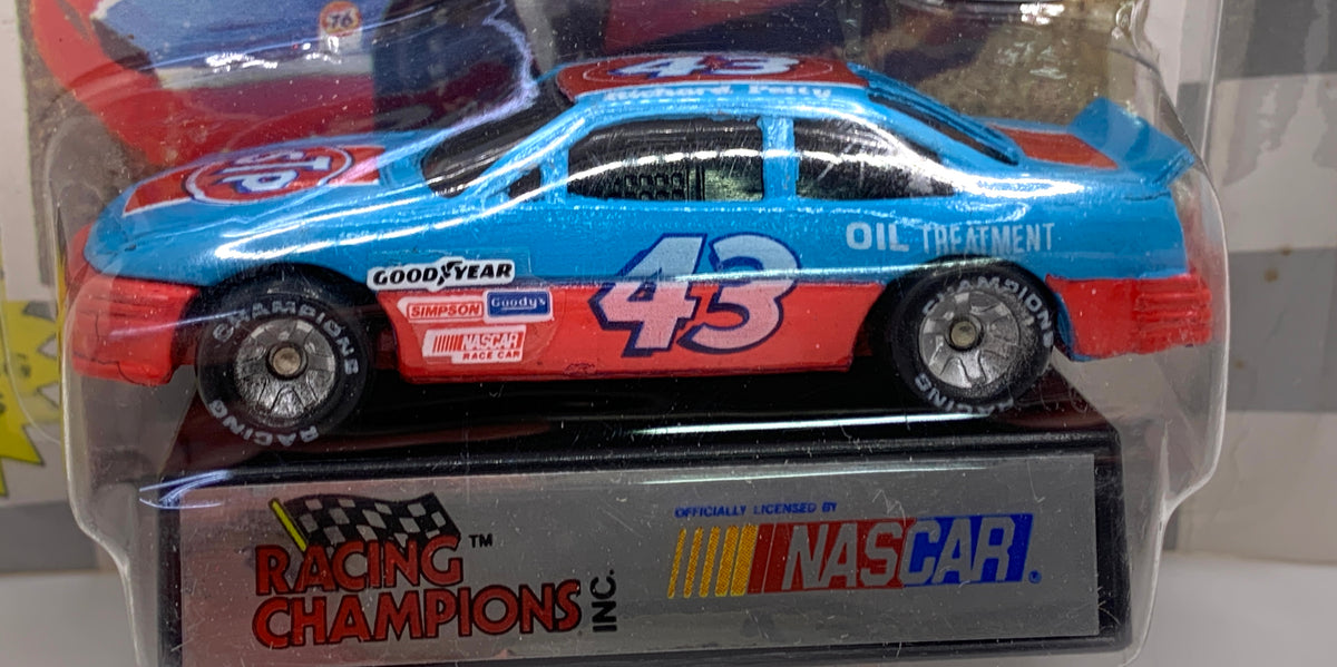 Richard Petty #43 Plymouth NASCAR Diecast Car & Goodyear Tire Display - 1:64 Scale 1991 Racing Champions