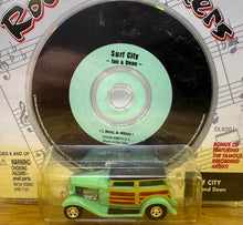 Load image into Gallery viewer, 1945 Ford Woody - Johnny Lightning Rock N Rollers includes single CD of Surf City by Jan and Dean